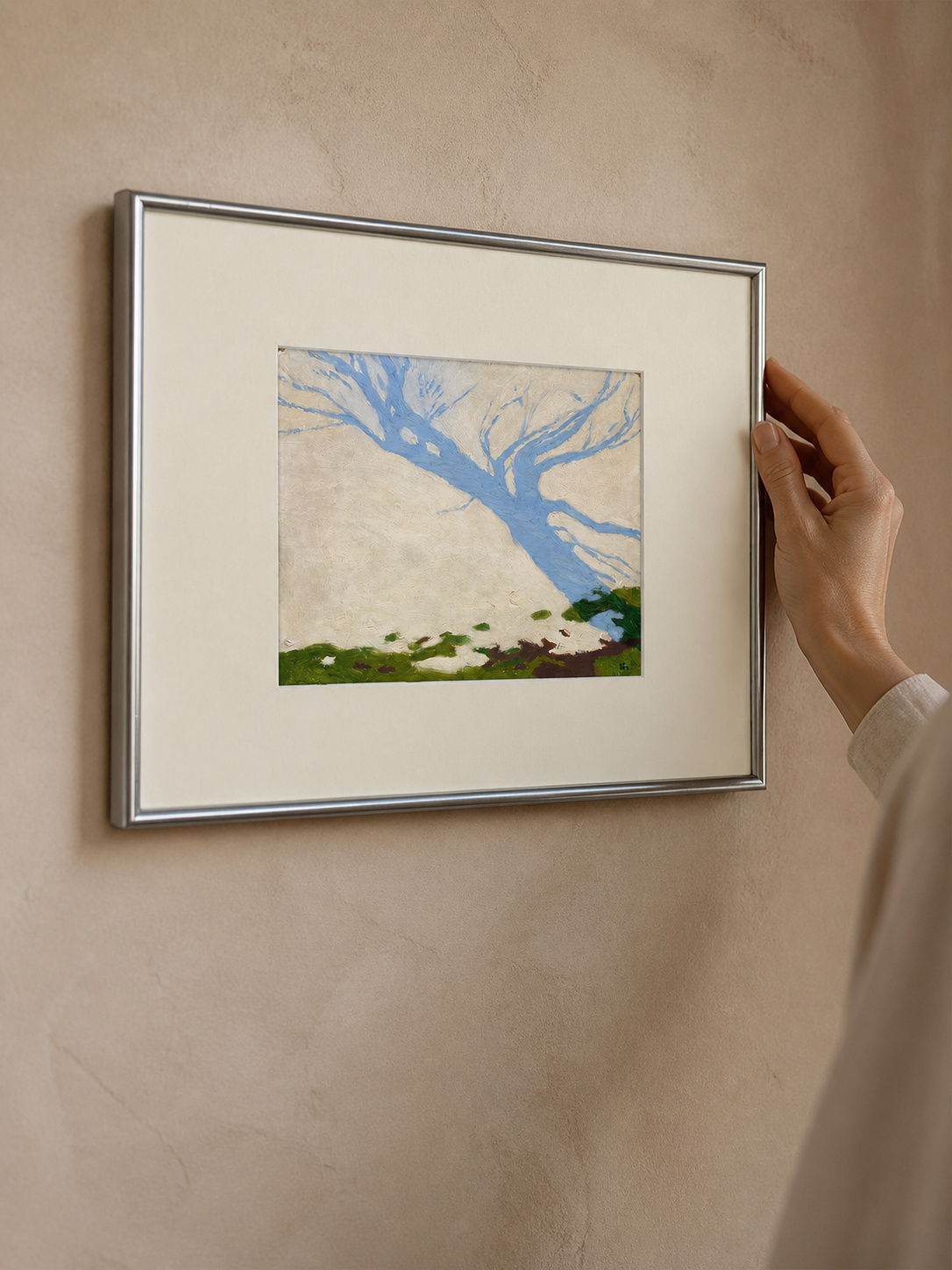 MOOJI ART, hand positioning the framed Snow Shadow landscape artwork, product 3925989610